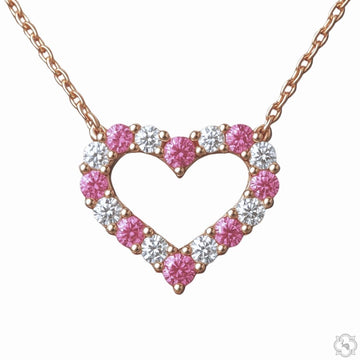 Pink sapphire and diamond heart pendant necklace — front-facing view showing heart silhouette with gemstone and diamond setting