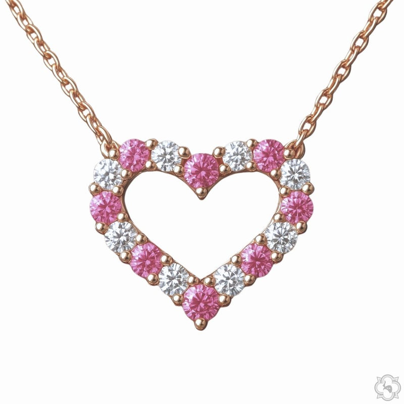 Pink sapphire and diamond heart pendant necklace — front-facing view showing heart silhouette with gemstone and diamond setting
