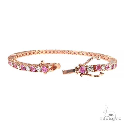 Rose gold tennis bracelet with alternating pink sapphires and round diamonds