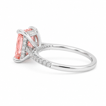 White gold engagement ring featuring a radiant-cut pink lab grown diamond, pavé diamond band, and diamond hidden halo.