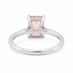 White gold engagement ring featuring a radiant-cut pink lab grown diamond, pavé diamond band, and diamond hidden halo.