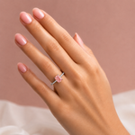 White gold engagement ring featuring a radiant-cut pink lab grown diamond, pavé diamond band, and diamond hidden halo.