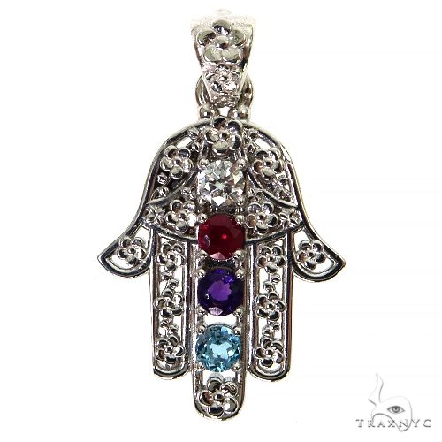 Platinum Hamsa pendant with clear, red, purple, and blue birthstone gems in intricate design