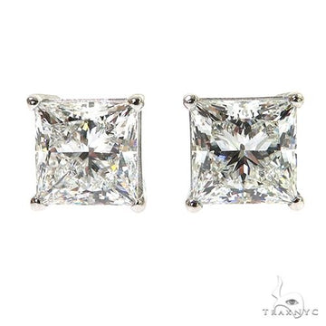 White gold princess cut diamond stud earrings with four-prong setting.