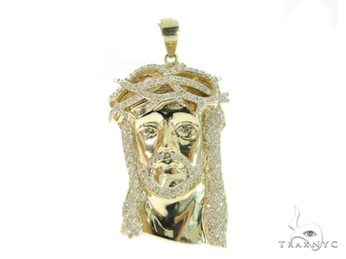 Yellow gold Jesus pendant with prong-set diamonds and detailed facial features
