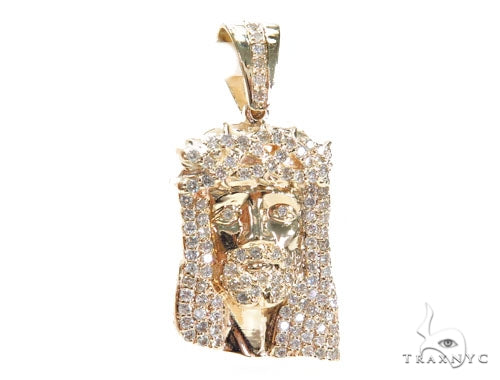 Yellow gold Jesus pendant encrusted with prong-set diamonds on the face and hair