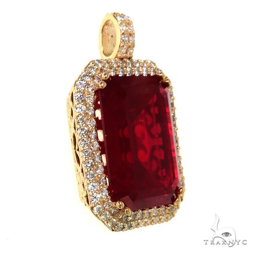 Rose gold pendant with large emerald-cut red gemstone and diamond halo accents