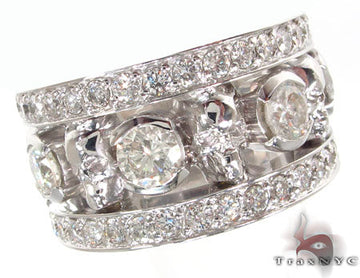 Wide 18K white gold skull ring encrusted with diamonds along the band and skull