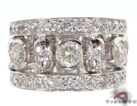 Wide white gold skull ring with diamonds encrusted along band and on skull accents