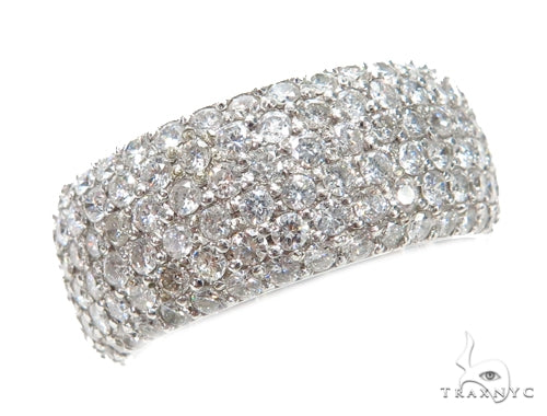 Wide prong-set diamond men's ring in white gold with multiple sparkling diamonds