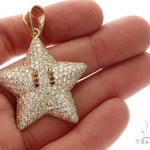 Yellow gold star pendant encrusted with diamonds and red gemstone eyes, men's jewelry.
