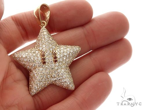 Yellow gold star pendant encrusted with diamonds and red gemstone eyes, men's jewelry.