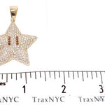 Yellow gold star pendant encrusted with diamonds and red gemstone eyes, men's jewelry.