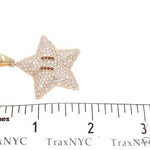 Yellow gold star pendant encrusted with diamonds and red gemstone eyes, men's jewelry.