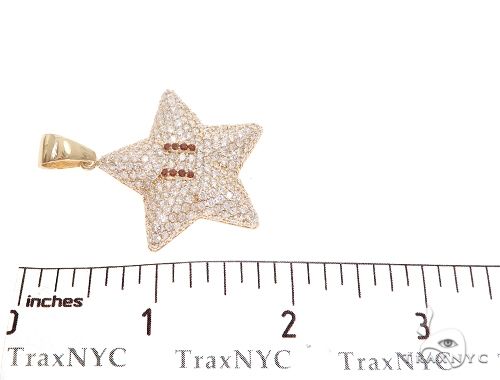Yellow gold star pendant encrusted with diamonds and red gemstone eyes, men's jewelry.
