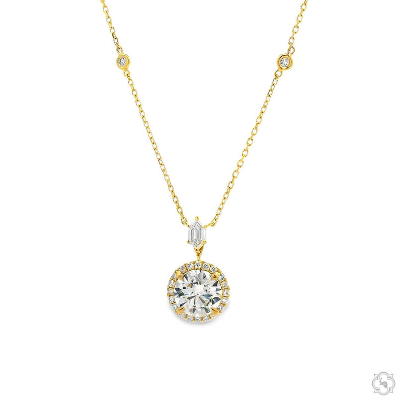 18K gold round cut diamond halo drop necklace with pavé halo, baguette accent, and bezel-set station chain