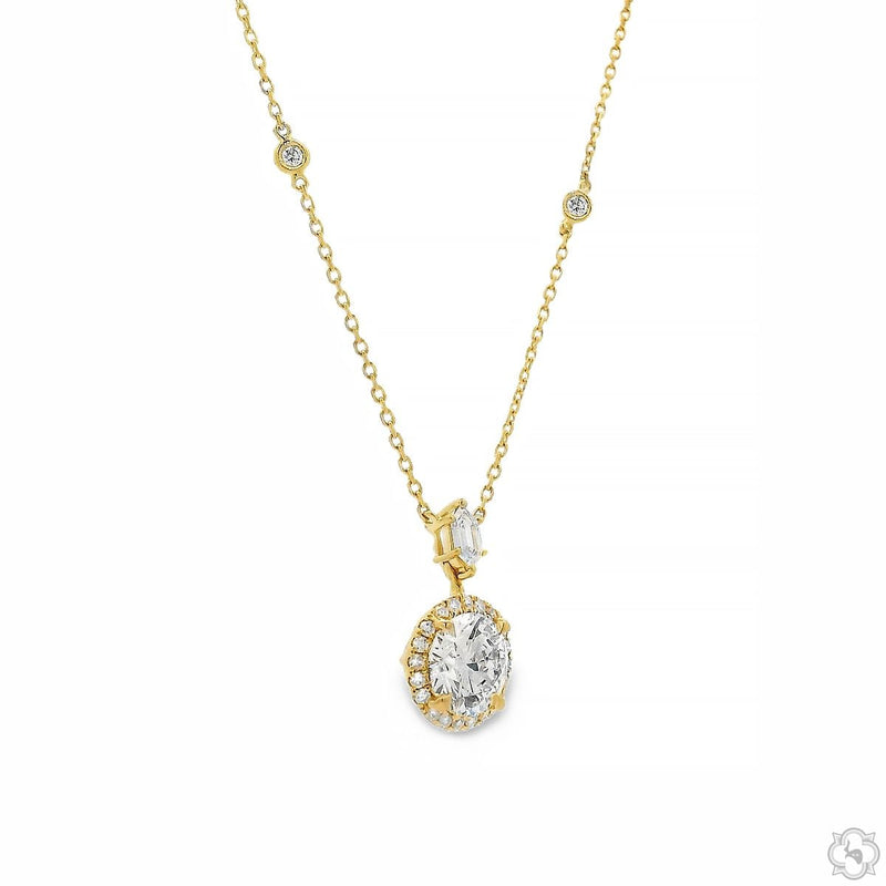 Yellow gold necklace with diamond halo pendant and diamond accents on chain