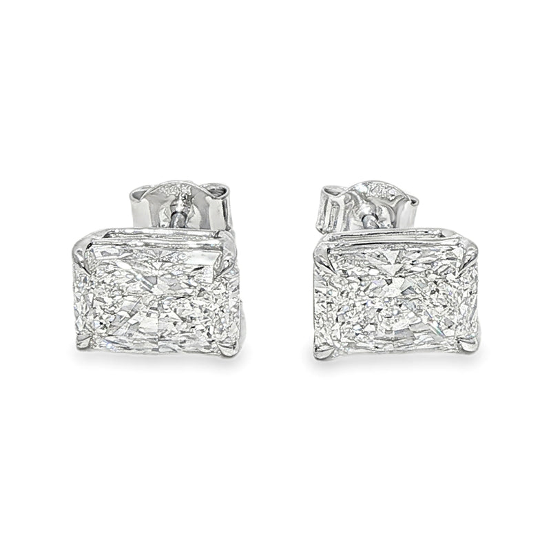 Pair of radiant cut diamond stud earrings with four-prong white gold setting, brilliant facets