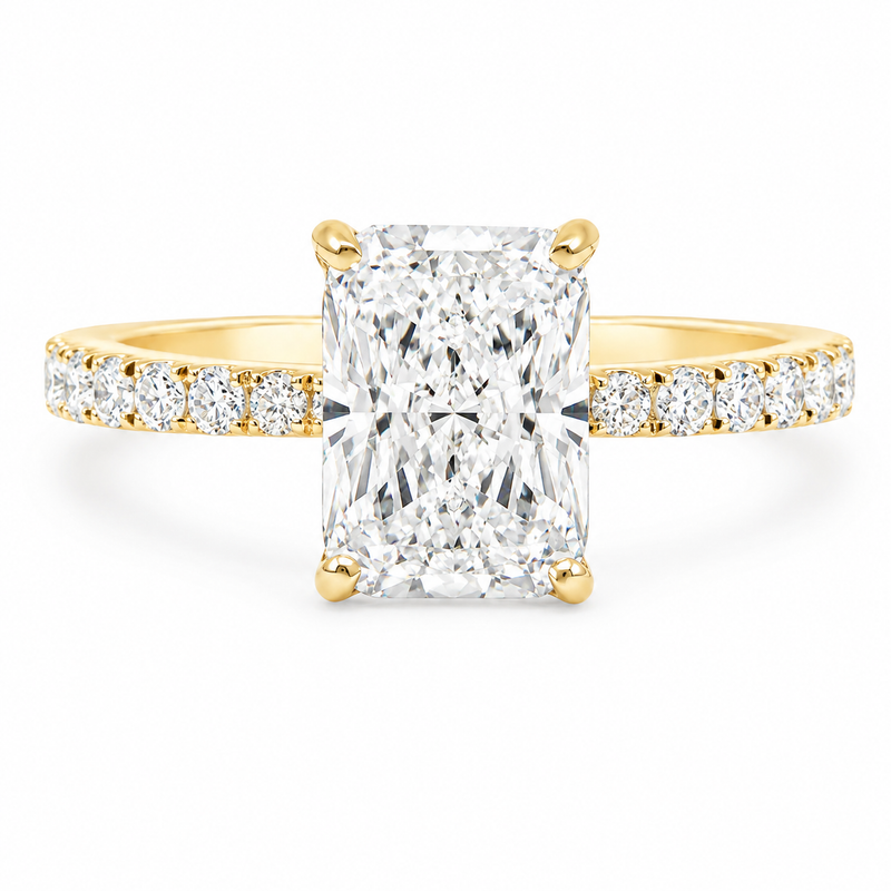 Radiant cut lab grown diamond engagement ring in 18K gold with hidden halo and tapered pavé band