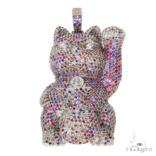Cat figurine encrusted with multicolored sapphire crystals, raised paw design.