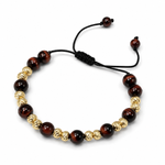 Adjustable men's bracelet with polished red tiger eye and textured gold beads on black cord.