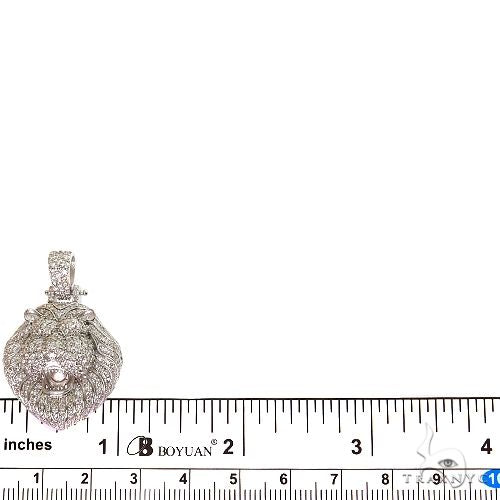 White gold lion pendant with diamond accents, detailed mane, and roaring expression