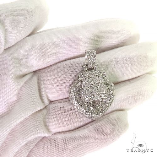 White gold lion head pendant encrusted with diamonds, detailed mane and fierce expression