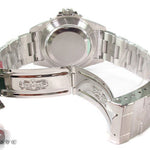 Rolex Submariner 16610 steel watch with black dial and green bezel, stainless steel bracelet.