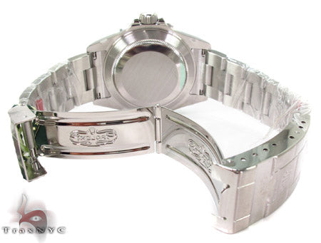 Rolex Submariner 16610 steel watch with black dial and green bezel, stainless steel bracelet.