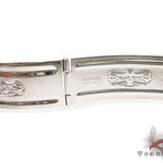 Rolex Submariner 16610 steel watch with black dial and green bezel, stainless steel bracelet.