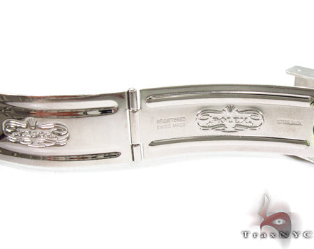 Rolex Submariner 16610 steel watch with black dial and green bezel, stainless steel bracelet.