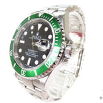 Rolex Submariner 16610 steel watch with black dial and green bezel, stainless steel bracelet.