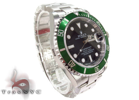 Rolex Submariner 16610 steel watch with black dial and green bezel, stainless steel bracelet.