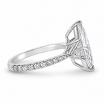 Marquise-cut lab-grown diamond three-stone engagement ring with trillion side stones and pavé diamond band.
