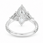 Marquise-cut lab-grown diamond three-stone engagement ring with trillion side stones and pavé diamond band.