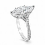 Marquise-cut lab-grown diamond three-stone engagement ring with trillion side stones and pavé diamond band.