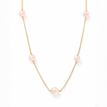 Delicate gold chain necklace with evenly spaced soft pink pearls for women.