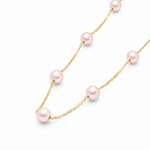 Gold chain necklace with evenly spaced soft pink pearls, delicate and elegant design.