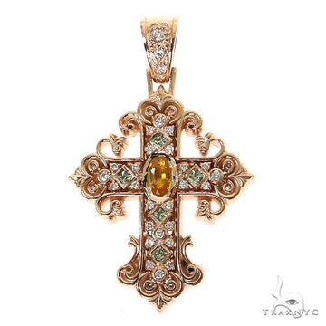 Rose gold cross pendant with central yellow sapphire and surrounding diamonds.