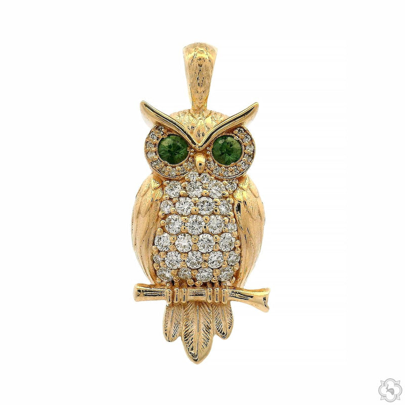 Yellow gold owl pendant with sapphire eyes and diamond-encrusted body on branch