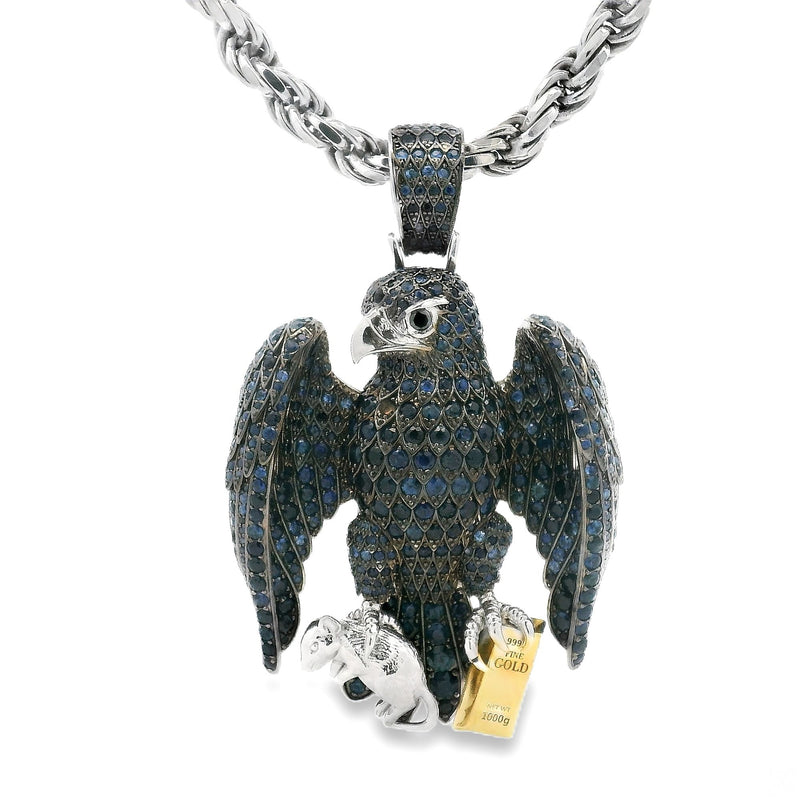 Silver hawk pendant encrusted with blue sapphires on a silver rope chain
