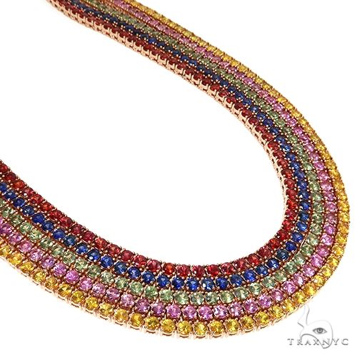 Multistrand tennis necklace with yellow, pink, red, blue, and green gemstones in gold setting
