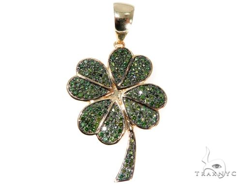 Yellow gold shamrock pendant with green diamonds and polished finish