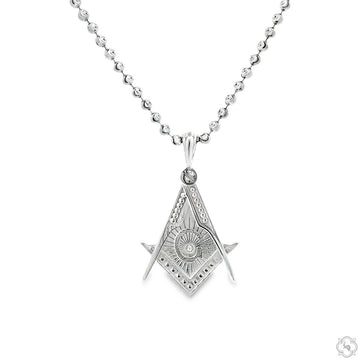 Small silver Masonic emblem pendant with intricate design on a beaded chain necklace.