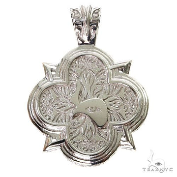 Silver logo pendant showing TraxNYC branding, polished front face, close-up angle