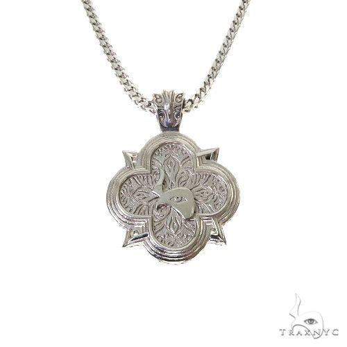 Silver clover-shaped Trax logo pendant with intricate detailing on a Franco chain.