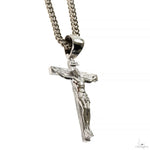 Silver Jesus crucifix pendant with detailed Franco chain necklace.