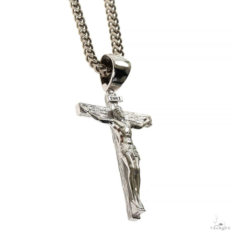 Silver Jesus crucifix pendant with detailed Franco chain necklace.