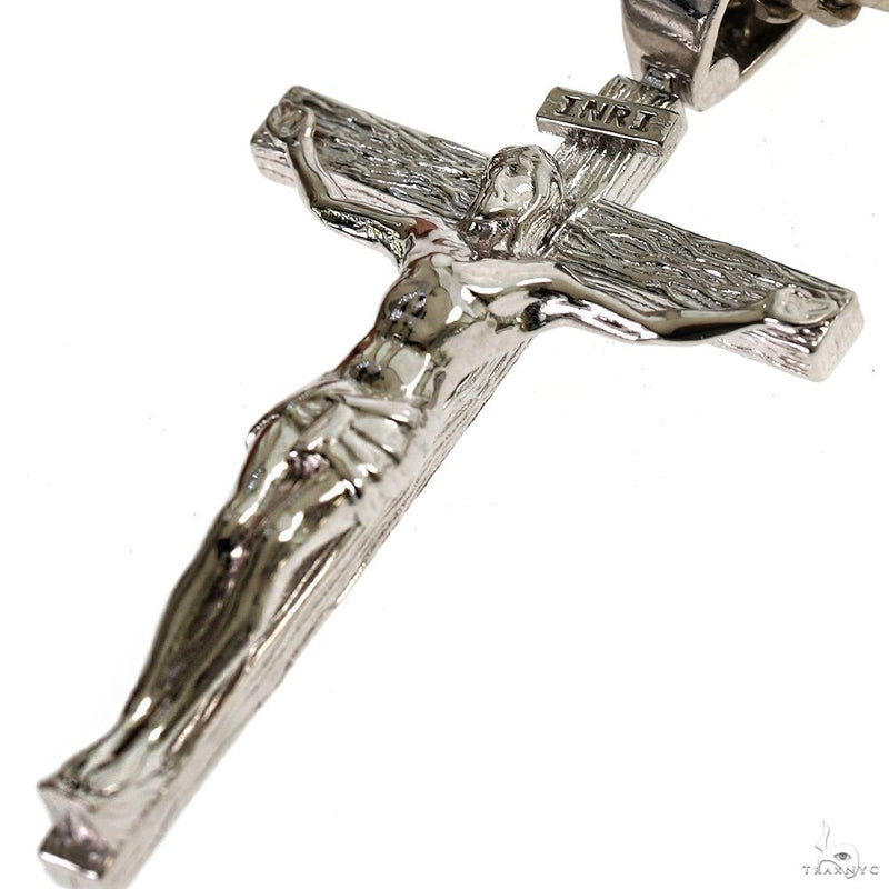 Silver Jesus crucifix pendant with detailed Franco chain necklace.