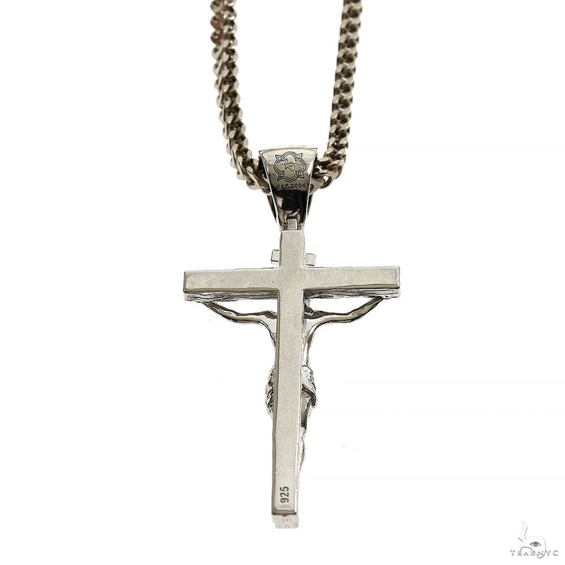 Silver Jesus crucifix pendant with detailed Franco chain necklace.